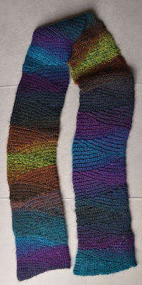 Shadow Spectrum slip stitch scarf graduates through purple, turquoise, browns and greens.