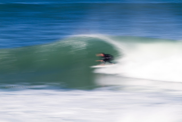 blur surfer surfing waves at bronte beach sydney australia