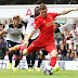 James Milner of Liverpool scores against Tottenham Hotspur