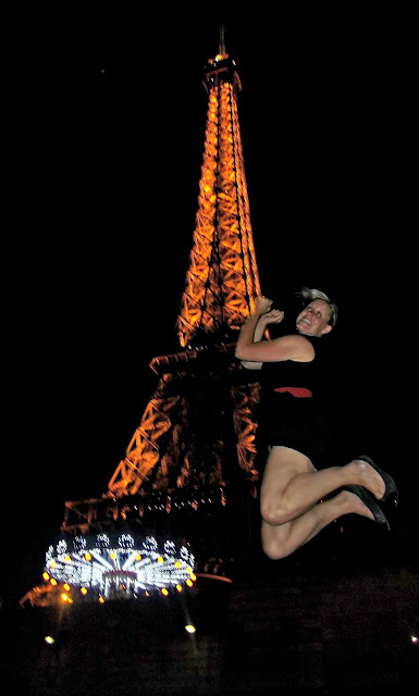 Take a leap at night in front of the Effiel Tower