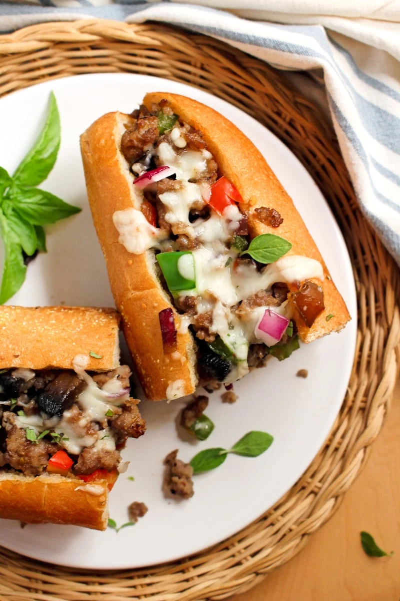 These Oven Baked Sausage Sandwiches loaded with ground Italian sausage and veggies make the perfect dinner on a busy night! #sausage #sandwich #dinnerrecipe