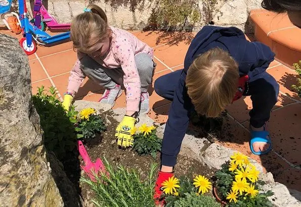 The photos show Hereditary Prince Jacques and Princess Gabriella planting flowers in the garden at Roc Agel in Monaco