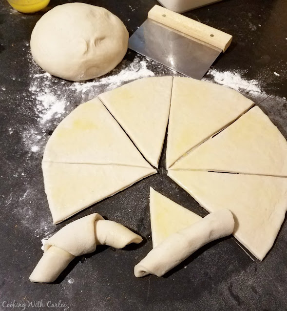 cutting and rolling crescent rolls sourdough crescent dough rolled out and cut into wedges