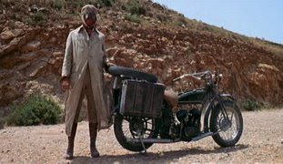 James Coburn as IRA dynamite expert and revolutionary John H. Mallory, bike punctured scene, John's face covered, Directed by Sergio Leone