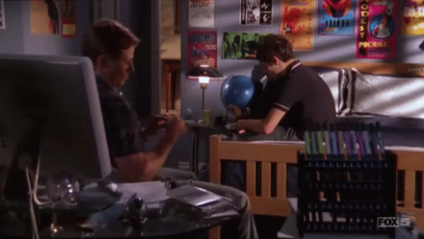 Ryan Atwood spins in his chair while talking with Seth The O.C.