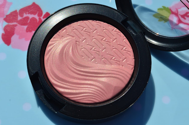 Blusher compact open showing the raised rippled pan