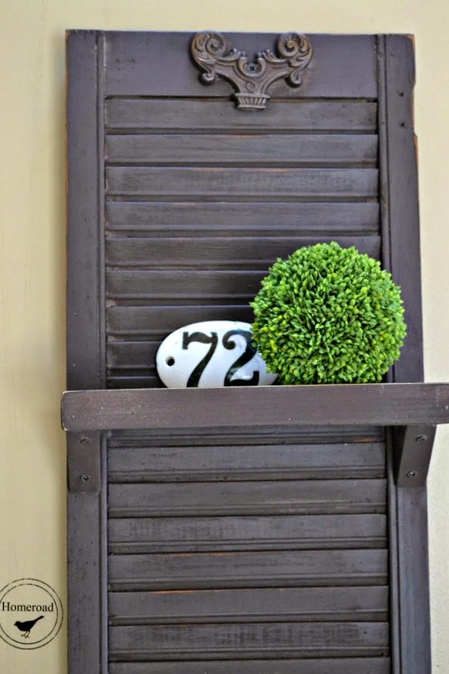 shelf made from a shutter with enamelware number