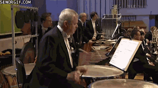 televised orchestra performance percussion funny fail gif