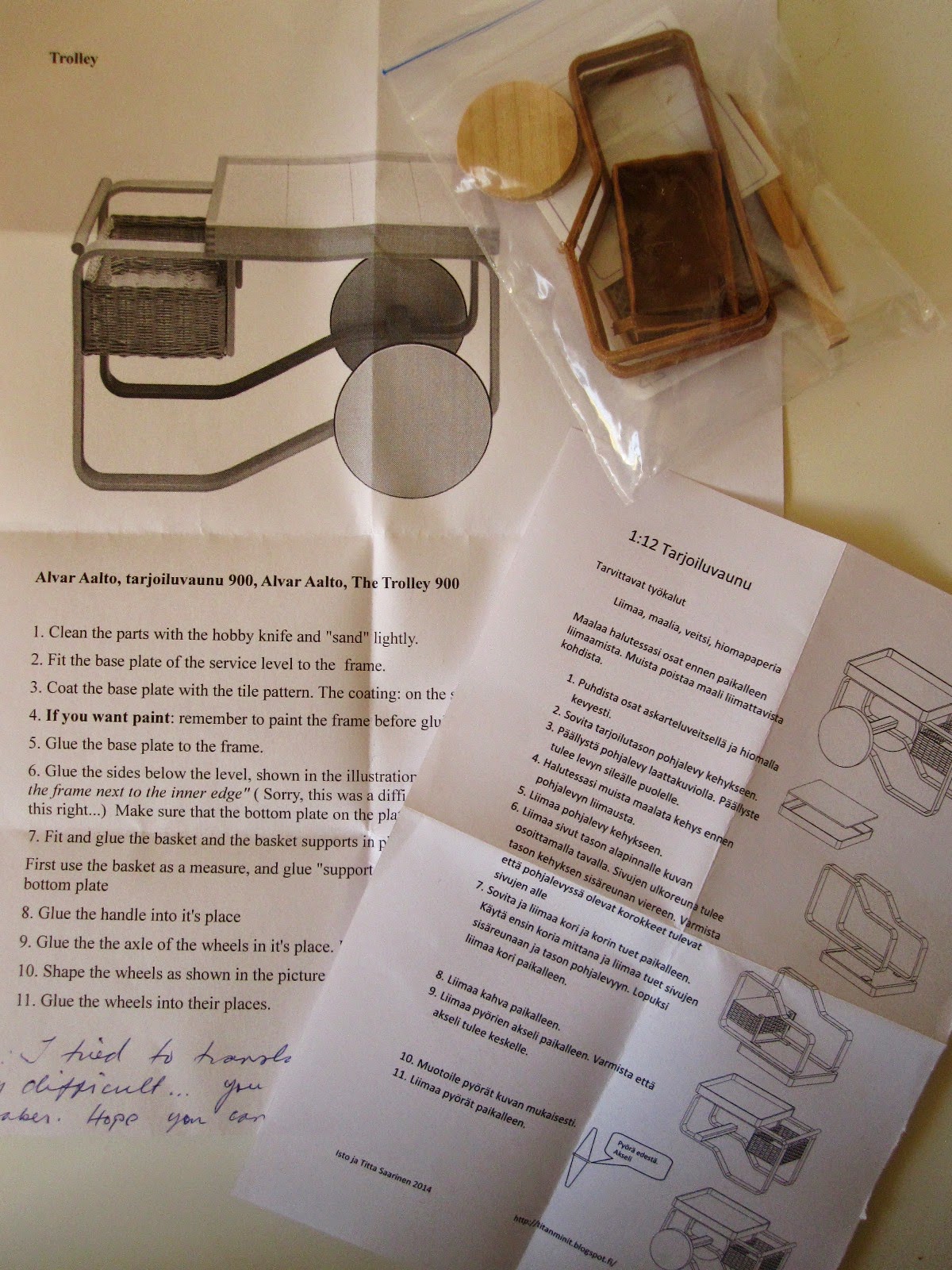 Pieces for a kitset miniature Aalto 900 trolley, plus instructions sheets in Finnish and English.