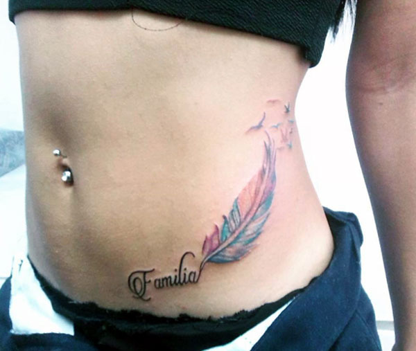 Feather with flying birds and familia letter this is the most popular feather tattoo designs