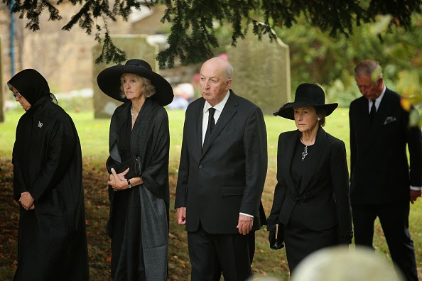 Prince Charles, Prince of Wales (R) follows the Duke and Duchess of Devonshire, Lady Sophia Cavendish (2ndR) and Lady Emma Cavendish (L) during the funeral of Deborah, Dowager Duchess of Devonshire makes it's way to St Peters Church, Edensor, past Chatsworth House on 02.10.2014 in Chatsworth, England.