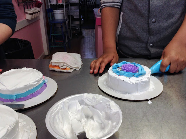 Cake decorating at Wild Flour Bakery for Mother's Day