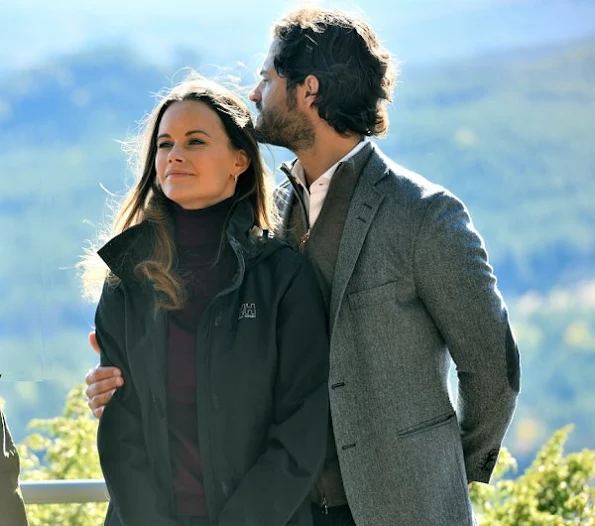 Prince Carl Philip and Sofia Hellqvist at opening of Hykjeberget Nature Reserve. Princess Sofia Hellqvist Style wore new sesion dress bag earring diamond, new sesion wool cardigan sweater coat
