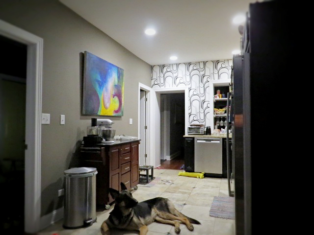 view into kitchen and newly painted custom color wall
