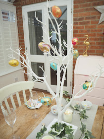 How to decorate a small dining room table and chairs for easter using decorative twig tree, plastic marble effect eggs, artificial ivy and mini eggs in teacups