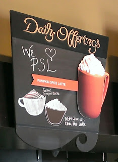 starbucks sign advertising pumpkin spice latte