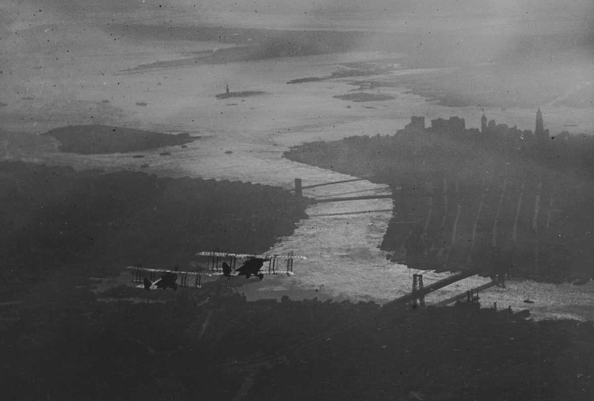 Aircraft fly above New York City.