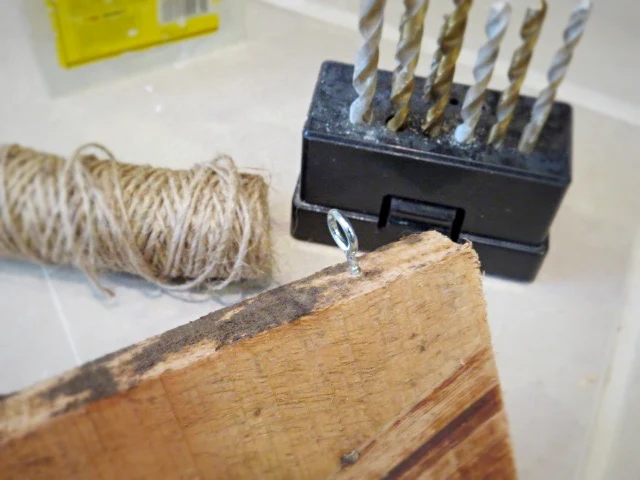 drill bits and eye hook with twine