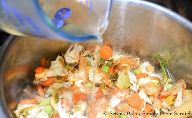 Seafood Stock Recipe stir in white wine from Serena Bakes Simply From Scratch.