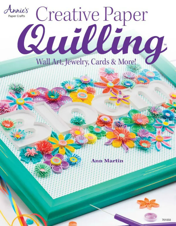 Creative Paper Quilling how-to quill papercraft book cover with quilled flowers surrounding the paper word Bloom