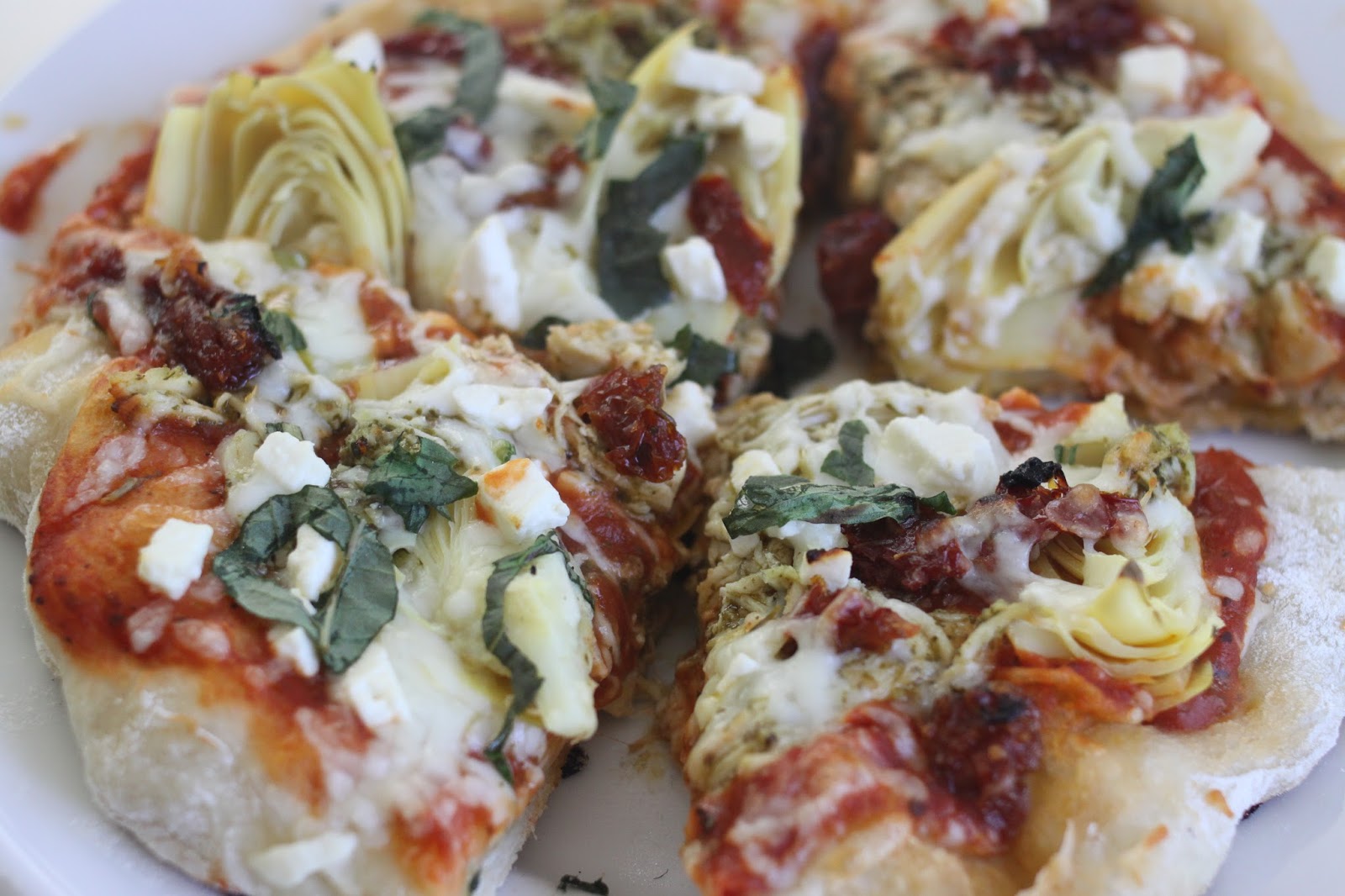 The Larson Lingo Pesto Chicken, Sun Dried Tomato & Artichoke Pizza