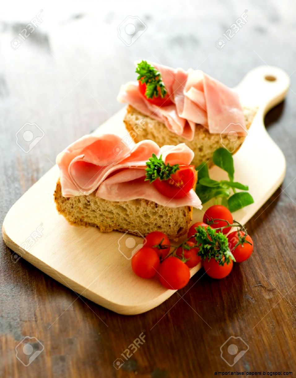 Delicious Ham Tomato Sandwich With Fresh Parsley On Wooden Table