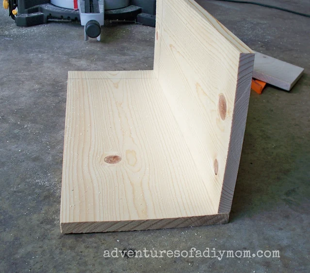 two boards making the beginnings of a toy box