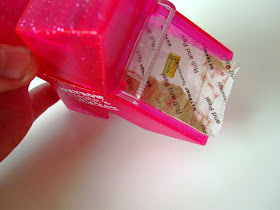 A Xyron 150 Create-a-Sticker machine with a dolls' house miniature marmalade jar label turned into a sticker.
