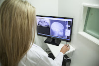 dentist looking at a jaw xray