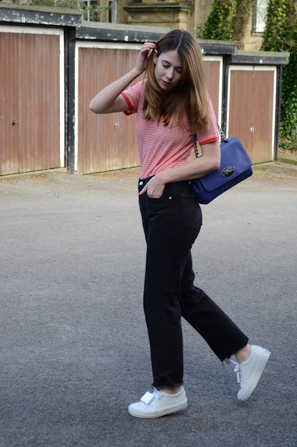 Red and white breton striped top from Urban outfitters, Black Vintage Levis 501 jeans, White Acne trainers. Blue mulberry lily bag. Affordable fashion blogger, Hollies closet