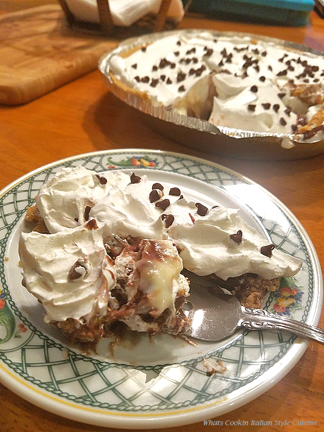 This is a fudge marble pudding pie made with vanilla and chocolate pie filling in a graham cracker crust.