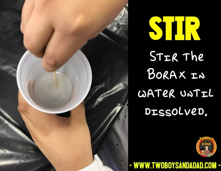 Stirring the borax in water to dissolve it