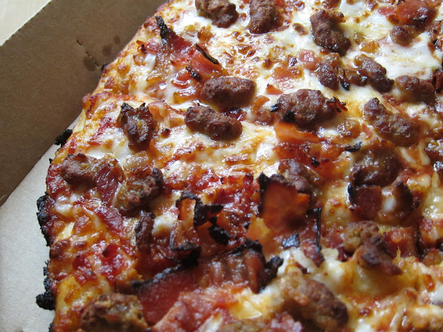 A close-up of the toppings on Domino's Handmade Pan Pizza.