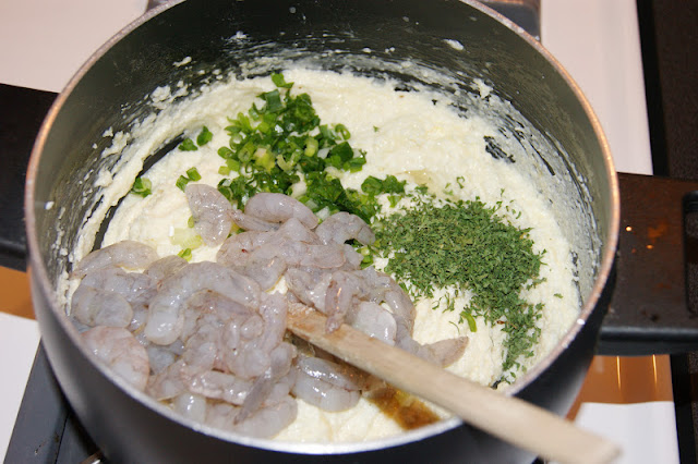 Stirring Together Ingredients to Make Shrimp and Grits Casserole Image