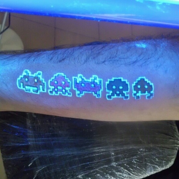 #29. Space invaders. - 30 Glow-In-The-Dark Tattoos That’ll Make You Turn Out The Lights. #29. Space invaders. - 30 Glow-In-The-Dark Tattoos That’ll Make You Turn Out The Lights.