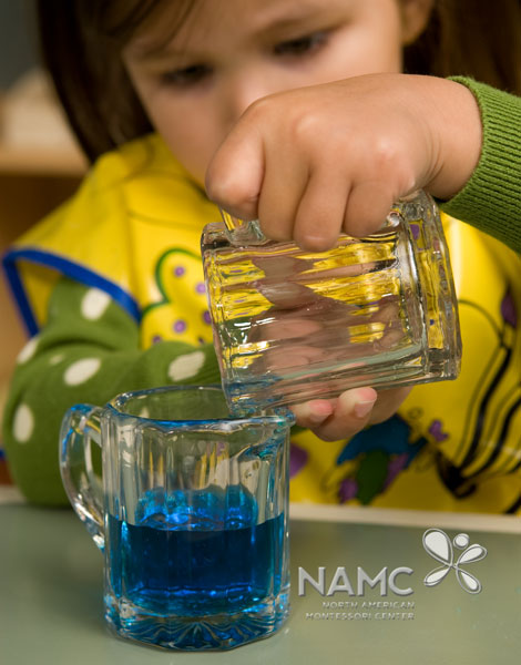 namc montessori functionality environment. child holding pitcher