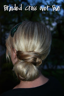 Twist Me Pretty's Abby Smith provides a detailed guide on how to create this gorgeous hairstyle, in her book The Ultimate Hairstyle Handbook. Braided cross-over bun.