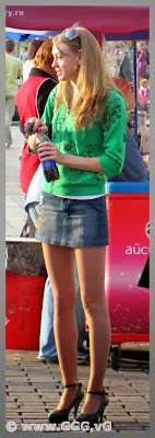 Slim girl in jean mini skirt on the street