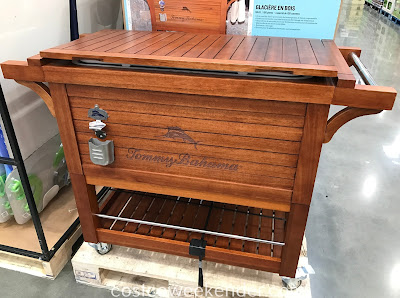 Keep drinks cool for an outdoor gathering with the Tommy Bahama Wood Rolling Cooler