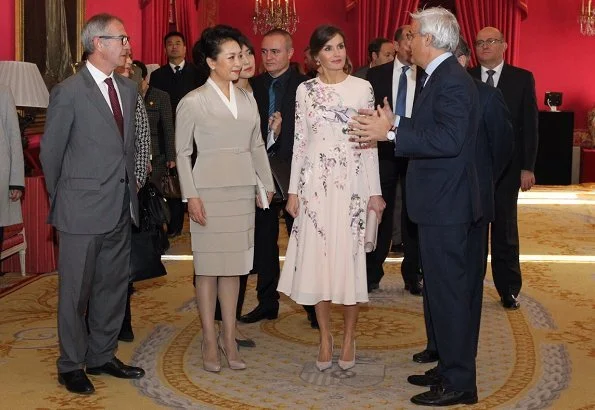 Queen Letizia wore ASOS DESIGN Tall midi dress with pretty floral and bird embroidery.  First Lady Peng Liyuan. Carolina Herrera coat