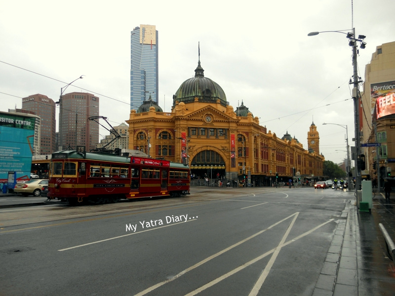 Three icons - City circle tram and Flinders street station, Eureka Sky deck Melbourne Australia