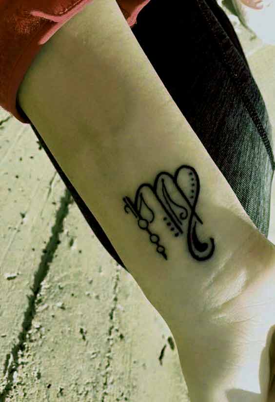 Virgo zodiac with music letter tattoo design on wrist