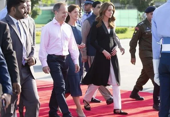 Kate Middleton wore a Kurta by Elan, one of Pakistan's leading design houses. Kate wore a crossover flat shoes by Russell and Bromley
