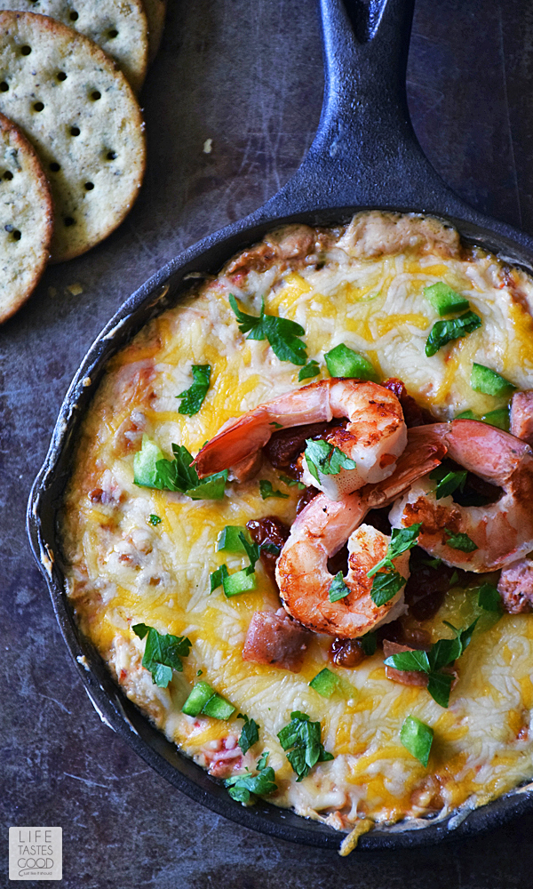 The finished Skillet Jambalaya dip topped with whole shrimp & cilantro ready to serve this Mardi Gras Appetizer