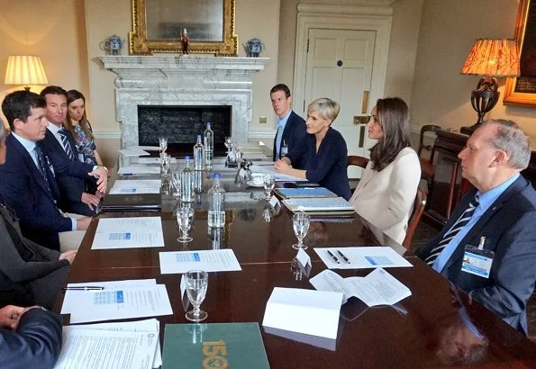 Kate Middleton meets Tennis coach Judy Murray and former British tennis player Tim Henman. Duchess wore a GOAT Fashion Redgrave cashmere coat