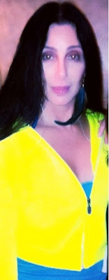 Cher in a bright yellow tracksuit top