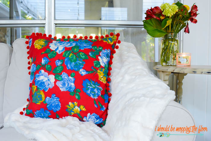 Vintage Fabric Pom Pom Pillow | Make this cute, envelope, pom pom pillow with this simple-to-follow tutorial (she used a vintage Joan Kessler fabric, but any fabric will work!). 