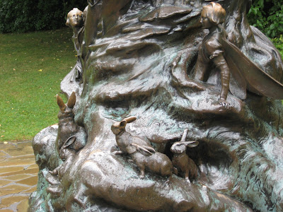 Photo of the rabbits and fairies on one part of the Peter Pan statue pedestal | Two Hectobooks