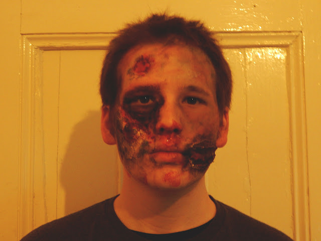 Guy with zombie makeup on.