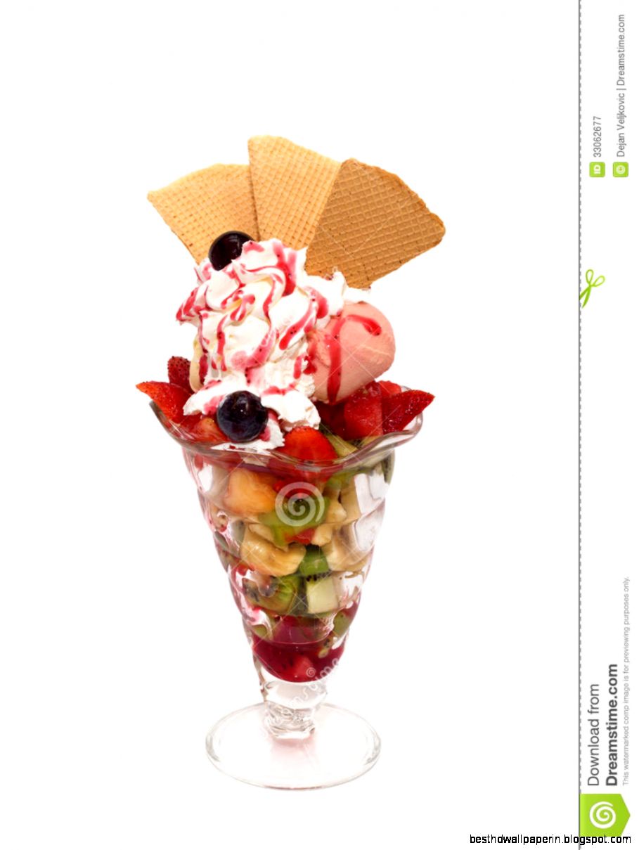Fruit Salad With Icecream Cream Topping And Cookies Isolated